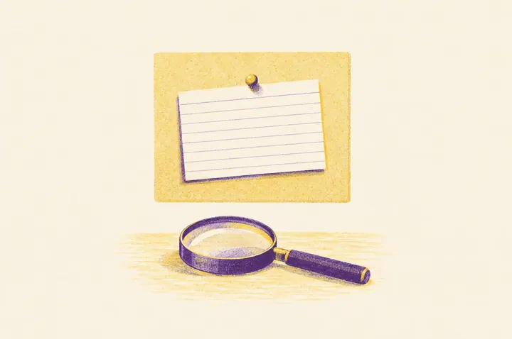 Illustration of one lined index card held by a single brass pin to a small pale yellow pinboard, with a magnifying glass resting on the desk below it