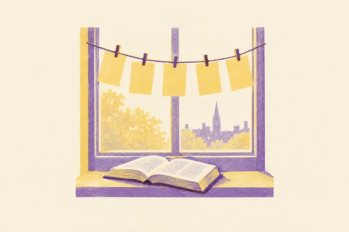 Illustration of blank word cards pegged on a string across a classroom window like bunting, with a dictionary lying open on the sill below